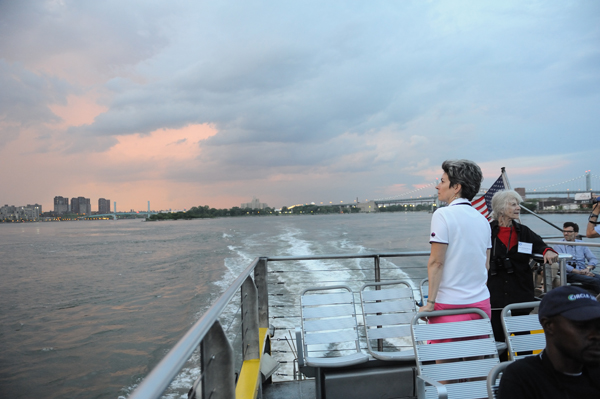 At sunset, as the Audubon Eco-cruise up the East River to the Brother Islands heads back to the South Street Seaport, passengers continue to scan the sky and water for birds as they watch darkness settle over the city. (Photo: Terese Loeb Kreuzer)