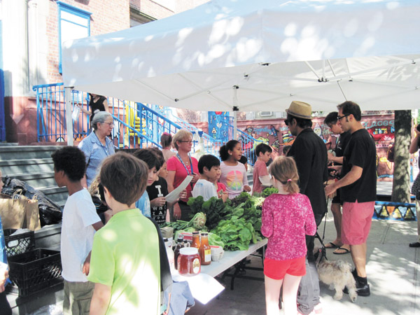 At the PS 11 Farm Market, kids rule the roost.