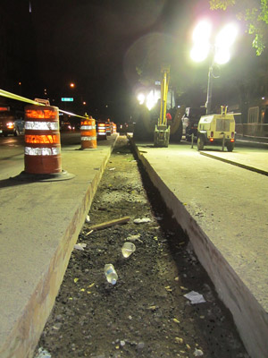 Photo by Lincoln Anderson Workers installed new wiring under this ditch between E. First and Second Sts. on First Ave. after an explosion knocked out one of the area network’s two feeders.