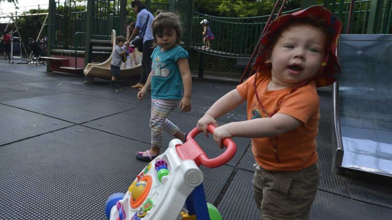 Jackson Heights 17 Fourteen-month-old Aiden Sunshine motors around Travers Park in Jackson Heights. (June 15, 2013)
