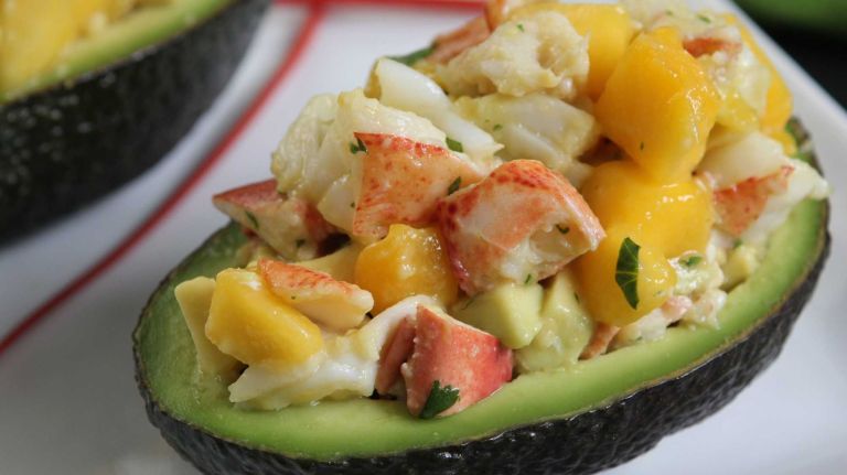 <b>WHAT YOU'LL NEED</b>:<br> 2 ripe avocados<br> 1 lime, cut in half<br> 1 1/3 cups (about 7 ounces) chopped cooked lobster meat<br> 1 mango, diced<br> 1 tablespoon lime juice<br> 1 tablespoon plus 1 teaspoon extra-virgin olive oil<br> 1 tablespoon cilantro, chopped<br><br> <b>HOW TO</b>:<br><br> 1. Cut avocados in half and remove pits. Scoop out interior of each half, leaving a 1/4-inch-thick wall all the way around. Rub top of wall with a cut lime and set aside. Chop scooped out avocado into 1/4-inch pieces.<br><br> 2. Toss the chopped avocado, lobster, mango, lime juice, oil and cilantro together in a bowl. Taste and add salt, if desired.<br><br> 3. Serve in scooped-out avocado halves. Makes 4 servings.