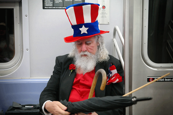 On July 4, Uncle Sam was spotted, not on a Citi Bike, but on the E train on his way up to view the fireworks at W. 23rd St.  Photo by Milo Hess
