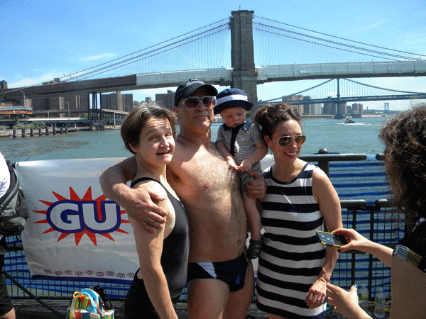If you can swim that, I’ve got a bridge for you 1 Photos by Tom McGann After the race, David Leslie posed for a photo with his wife Celest, right, son Brooks and Janet Clancy at Beekman Beer Garden Beach Club at the South Street Seaport, where awards were handed out to top finishers.