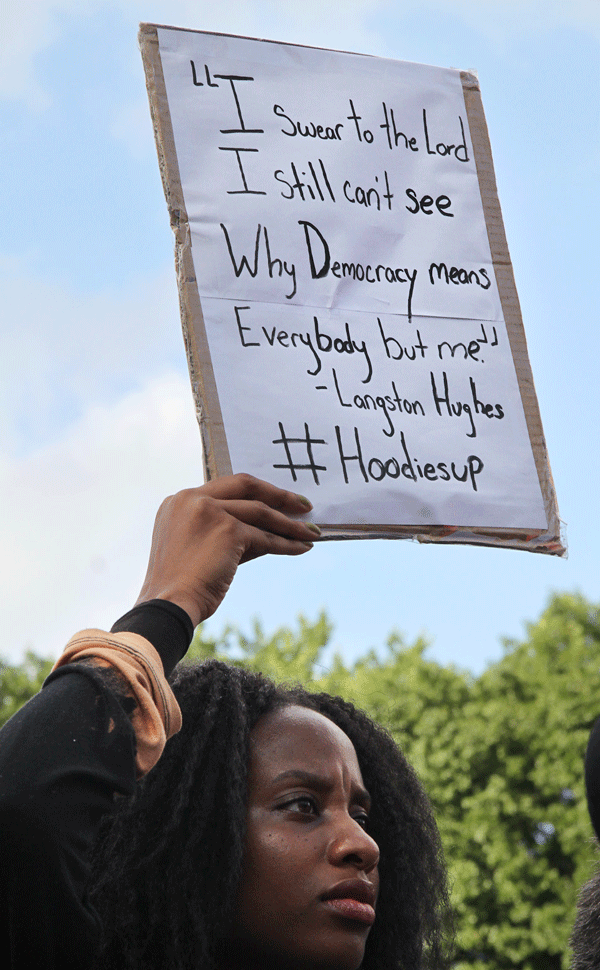 Photo by Tequila Minsky At Sunday’s protest in Union Square, a woman held a sign quoting the great African-American poet Langston Hughes.