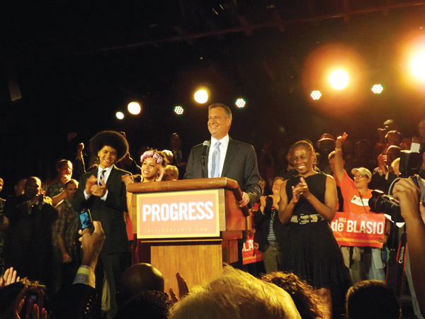 Photo by Duncan Osborne Public Advocate Bill de Blasio flanked by his son, Dante, his daughter, Chiara and his wife, Chirlane McCray.