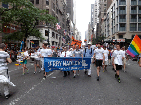 Photo courtesy of Gay City News Corey Johnson, center, with Congressmember Jerrold Nadler, to the left of him, and District Leader Jonathan Geballe, to the right, who have both endorsed Johnson, in the June LGBT Pride March.