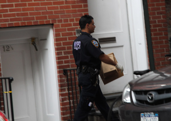 Photo by Tequila Minsky A police officer removed the prop bomb, which was concealed in boxes.