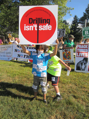Photo by Andrew Castrucci Renzo Castrucci, 8, who lives on E. Third St. in the East Village but summers in Mt. Upton, N.Y., joined the Aug. 23 anti-fracking protest when President Obama visited Binghamton.