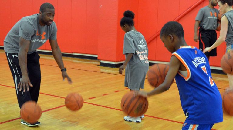 Knicks star Raymond Felton  leads a free basketball clinic at St. John's University for a group of more than 50 local children from the Big Brothers Big Sisters of New York City's youth mentoring program. (Aug. 18, 2013)