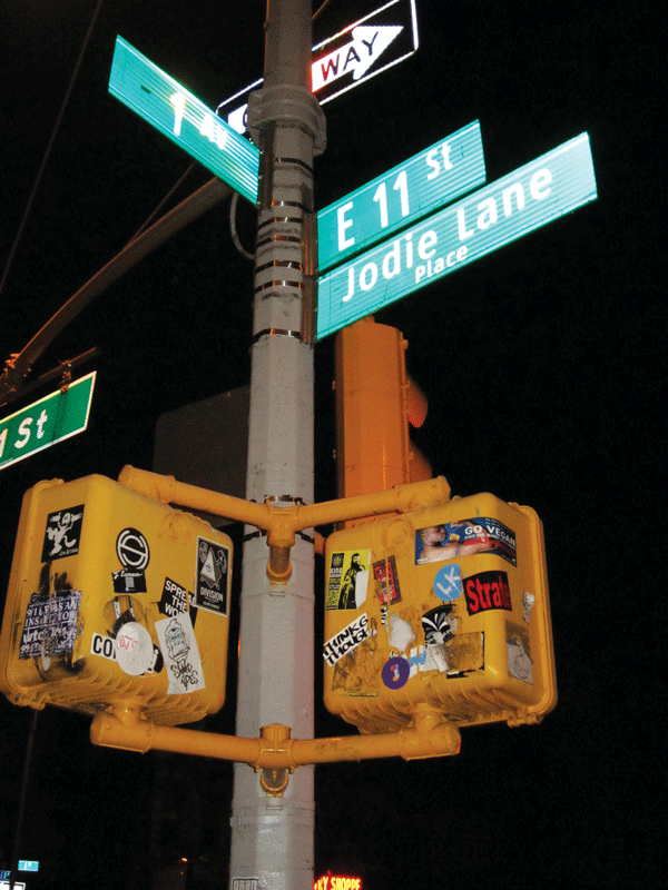 Photo by Lincoln Anderson As seen in this photo taken this week, the three formerly missing signs for Jodie Lane Place, E. 11th St. and First Ave. have all been restored to this lamppost at the intersection’s northwest corner.