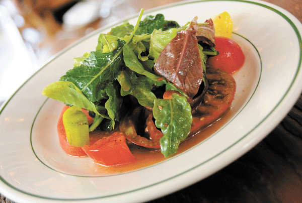 Rosemary’s signature heirloom tomato salad is made with fresh ingredients from upstairs.