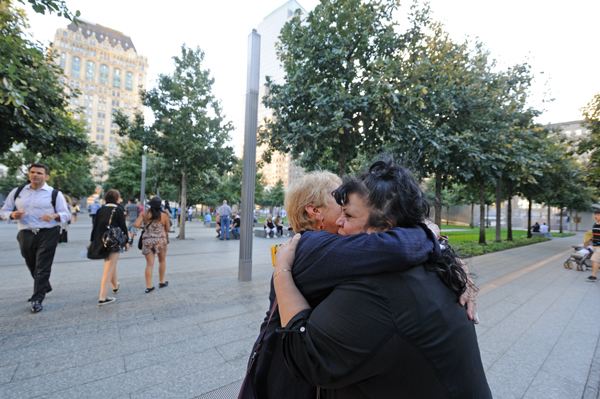 Susan Cole, left, of Battery Park City, and Diane Lapson from Tribeca embraced at the (/11 Memorial Sunday night, Sept. 8 at the memorial's Community Evening. Downtown Express photo by Terese Loeb Kreuzer..