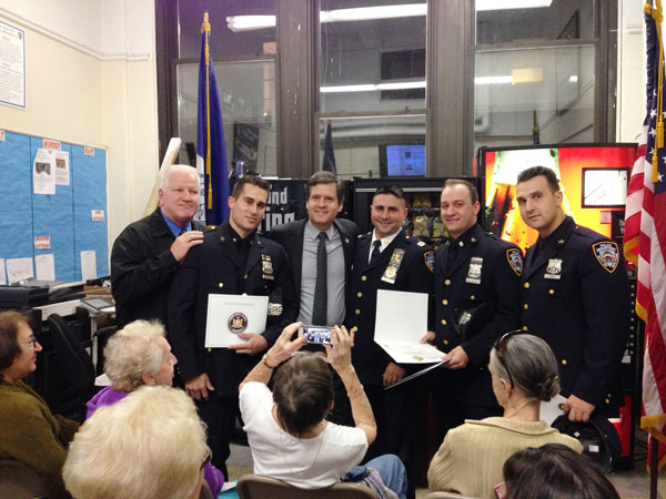 Officers Honored, Responders Remembered at 10th Precinct Community Council Meeting 2 Photo by Jared Chausow State Senator Brad Hoylman presents Cop of the Month winners (second, fifth and sixth from left) with a citation.