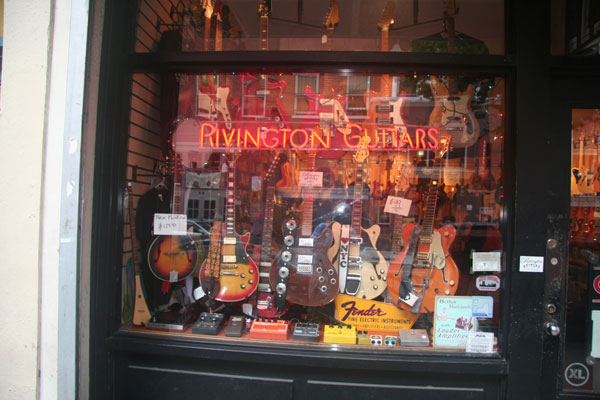 A good guitar is a work of art 2 Photo by Michael Lydon Owner Howie Statland moved his shop to E. Fourth St. (from Rivington) five years ago.