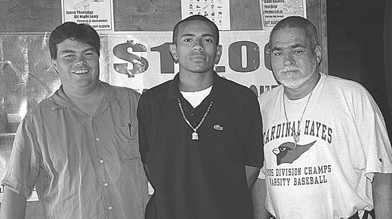 Downtown Express file photo Amid questions about his residency, David McWater, left, former chairperson of Community Board 3,  this week resigned as a member of Board 3. With him were L.E.S. Guachos standout Jonathan Gonzalez and Gonzalez’ godfather, Ron Fulco. 