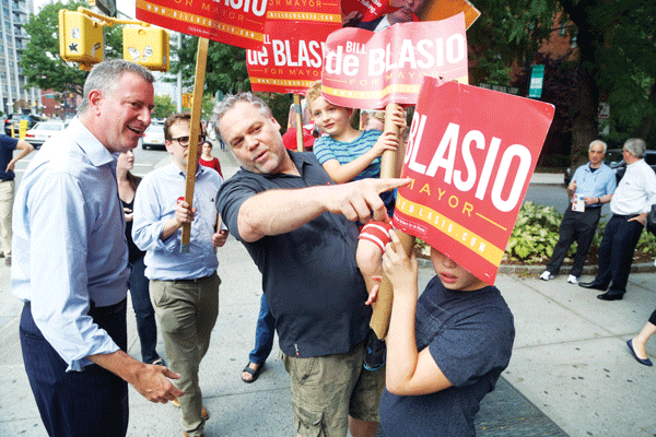 Photo by Jefferson Siegel Bill de Blasio, left, talked with actor Vincent D’Onofrio at a campaign stop outside Stuyvesant Town on Saturday evening.