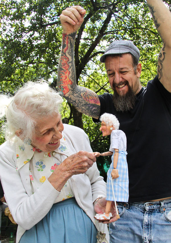 Photo by Tequila Minsky Doris Diether shakes hands with her new mini-me, controlled by Ricky Syers.