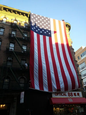 The flag after being slowly unfurled from the building’s rooftop.