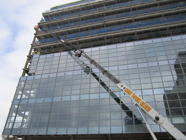 Photos by Lincoln Anderson The exterior glass facade is currently being installed on the Spring St. mega-garage.