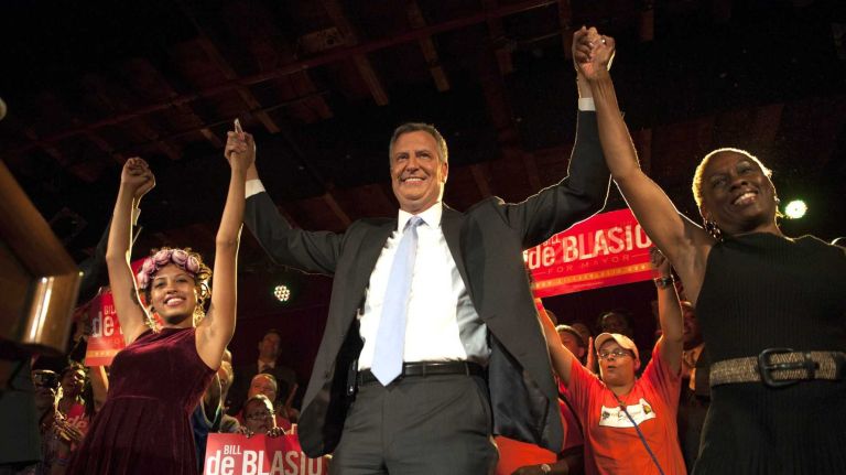 Democratic mayoral candidate Bill de Blasio celebrates with his wife Chirlane McCray and daughter Chiara de Blasio in Brooklyn. (Sept. 10, 2013)
