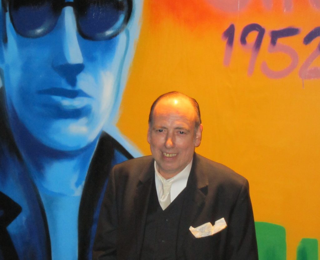 Mick Jones in front of the newly repainted Joe Strummer mural.  Photo by Lincoln Anderson