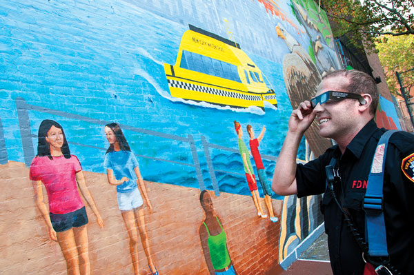 Getting the full effect of the renovated mural with 3D specs. The mural was not 3D before. Photo by Bob Krasner