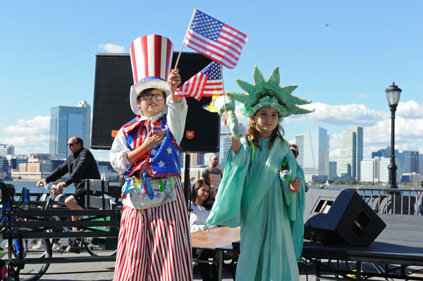 Battery Park City block party celebration 5 Downtown Express photos by Terese Loeb Kreuzer. Top, the New American Youth Ballet at the B.P.C. Block Party Sept. 28, the Seniors’ Chorus, and a pair of stiltwalkers.