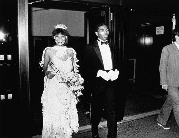 Lorraine O’Grady: Untitled (Mlle. Bourgeoise Noire and her Master of Ceremonies enter the New Museum). 1980-83, printed 2009. Gelatin silver print. 7 1/4 x 9 1/4 in. IMAGE COURTESY THE ARTIST AND ALEXANDER GRAY ASSOCIATES, NY