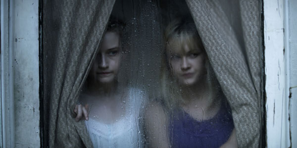 Photo courtesy of the filmmakers & distributor Julia Garner and Ambyr Childers star as sisters with a dark secret, in “We Are What We Are.”
