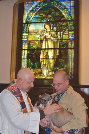 Photo by Chris Kreussling Rev. John Magisano, pastoral counselor for Chelsea Community Church, at 2012’s Blessing of Animals.