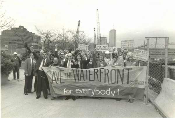 Even after Westway’s defeat, Villagers still had plenty to protest about on the waterfront. In 1989, above, they rallied against a plan for PATH train ventilation towers on the waterfront south of Christopher St. From left, Bill Hine (back row, fourth from left), Larry Selman, Ben Green, representing Assemblymember Bill Passannante, Miriam Lee of the Village Homeowners’ Association, Comptroller Harrison J. Goldin, then a mayoral candidate, Bob Oliver (partially obscured by raised hand) of the Federation to Preserve the Greenwich Village Waterfront & Great Port, Judy Seigel of the Morton Street Block Association, Vern Fry and Artie Strickler.   BROOKLYN COLLEGE LIBRARY ARCHIVES