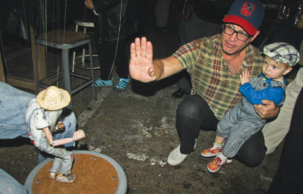The Villager newspaper celebrates 80 years! 6 David Leslie, the East Village activist and Brooklyn Bridge Swim phenom, and his son, Brooks, enjoyed meeting Mr. Stix at the party. High five!