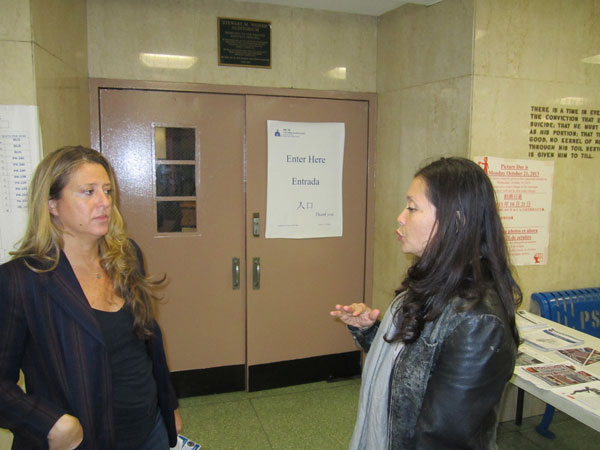 Ariel Palitz, left, told Diem Boyd she’s concerned about “a strange man” obsessively videotaping her at S.L.A. Committee meetings.