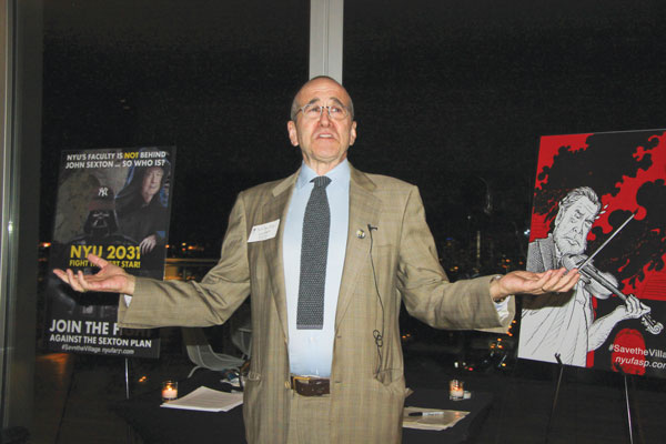 Photo by Tequila Minsky Professor Mark Crispin Miller spoke at the fundraiser, while flanked by posters of the N.Y.U. “Debt Star,” left, and of university President John Sexton fiddling like Nero as the Village burns, right.