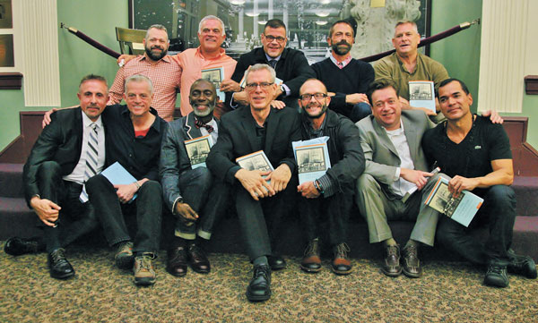 Perry N. Halkitis, at bottom left, joined some of the men he interviewed for “The AIDS Generation: Stories of Survival and Resilience.”   Photo by Sam Spokony 