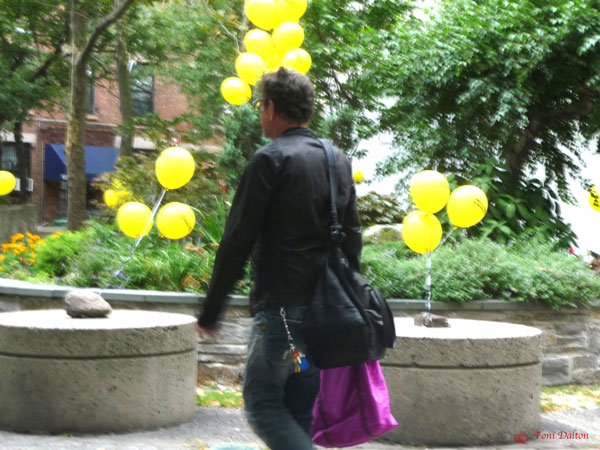 Lou Reed walking briskly through the courtyard at the Westbeth Artists’ Housing complex. Photo by Toni Dalton