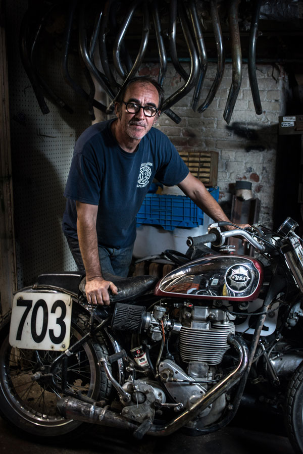 Photo by Claire Flack Hugh Mackie and his personal racing bike, a 1957 BSA factory race bike, one of 200 made. This year, he won the American Motorcycle Association Vintage National Dirt Track Championship Series with it. 