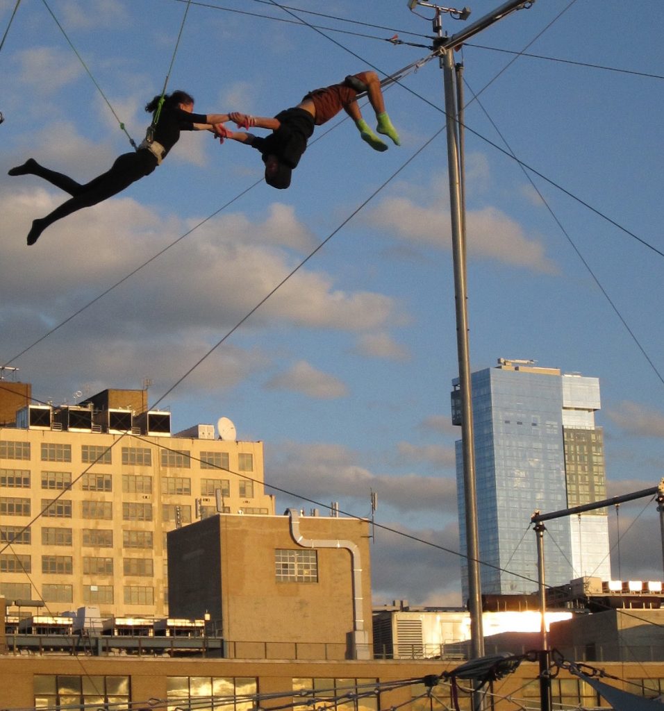 Park bill still up in the air, forum to consider air rights 2 Amid all the buzz about air-rights transfers from Hudson River Park, a couple of swingers at the New York Trapeze School on Pier 40’s rooftop caught some serious air last Sunday afternoon. Behind them, across West St., is the St. John’s Center building, which could receive unused air rights from Pier 40 under legislation awaiting Governor Cuomo’s signature. At right is the Trump Soho Condo Hotel. By one estimation, Hudson River Park currently has enough unused air rights for five Trump Soho's. Photo by Lincoln Anderson