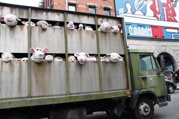 The street artist’s “Sirens of the Lambs” truck, with bleating sheep bound for the slaughterhouse, caused a commotion on Spring St.