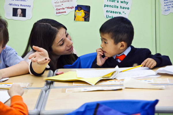 Teacher Jennifer Waldman gives special attention to a first-grade student at Success Academy Union Square.  Photo by Byron   Smith