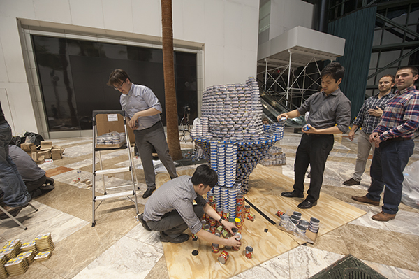 Canstruction returns to Brookfield Place 2 A team from DeSimone Consulting Engineers building a structure called "Sharknado — Take a Bite Out of Hunger" for the annual Canstruction exhibition at Brookfield Place. Sculptures are made of canned food that is donated to City Harvest shortly before Thanksgiving. Canstruction competitions are held in more than 140 cities around the world. (Photo: Terese Loeb Kreuzer)