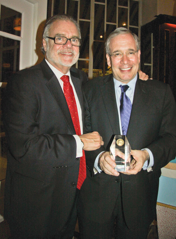 Clockwise, from top left: Lawrence B. Goldberg, president of Friends of LaGuardia Place, left, presented Scott Stringer with a LaGuardia Medallion; Goldberg with the staff of C.B. 2, from left, District Manager Bob Gormley, Florence Arenas, Julio Mora and, accepting the award for her daughter, Cynthia Harris; another LaGuardia Medallion honoree, Paul Colby, owner of The Bitter End; and sculptor Neil Estern.    Photos by Tequila Minsky