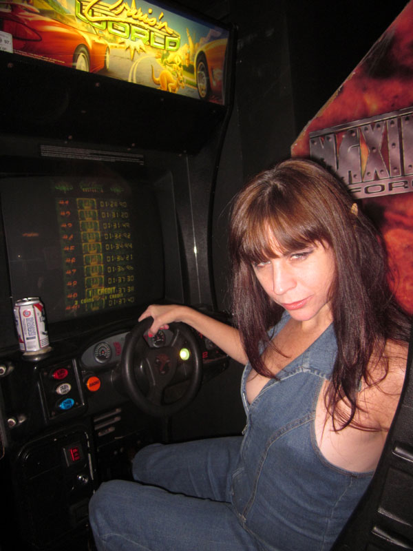 At Two Bits arcade, Rev. Jen demonstrates the only way to drive drunk.