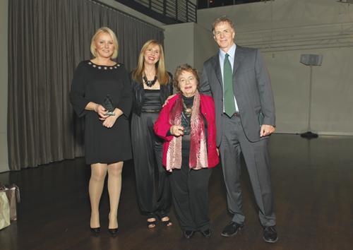 Villager publishers past and present accepted a special tribute award from VillageCare’s Emma De Vito, second from left, in honor of the newspaper’s 80th anniversary. From left, current Publisher Jennifer Goodstein and past publishers Elizabeth Butson and John W. Sutter.