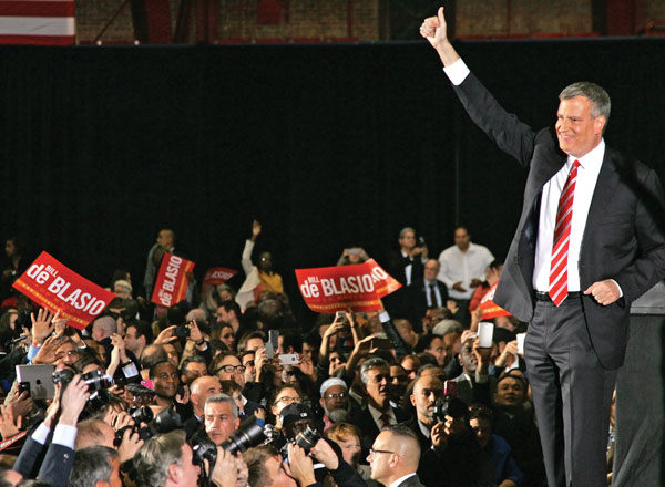 Bill de Blasio gave the thumbs up to the crowd as he announced his victory on Tuesday evening.  Photo by Sam Spokony