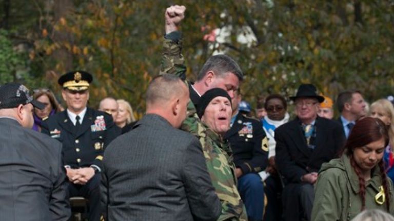 A person heckles Mayor Bloomberg at the Veteran's Day parade. (Nov. 11, 2013)