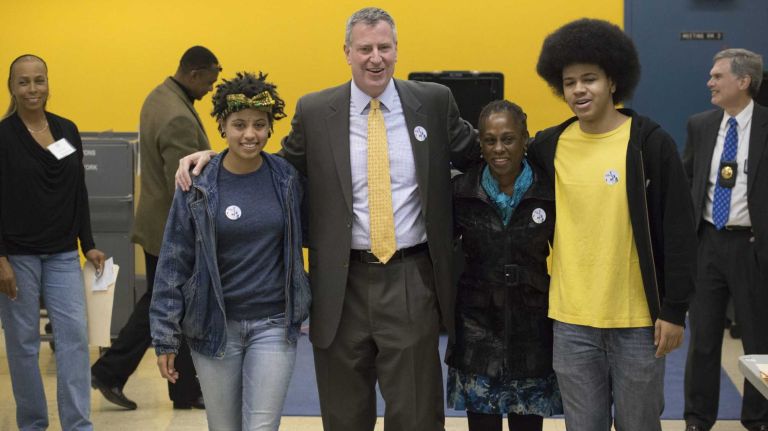 Democratic Mayoral candidate Bill de Blasio exits his polling place in Brooklyn on Nov. 5, 2013 with, from left, his daughter Chiara de Blasio, his wife, Chirlane McCray, and son Dante de Blasio.