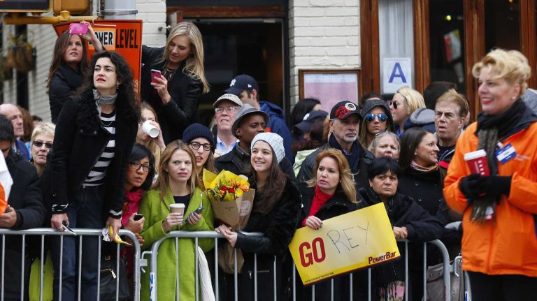 Spectators cheer on the runners during the ING New York City Marathon. 