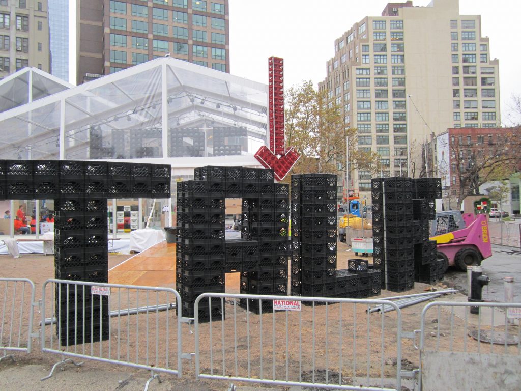 Talking Transition could be the start of something "crate." Crates are used to create the "TALK" sign in front of the large white tent at Duarte Square. Photo by Lincoln Anderson