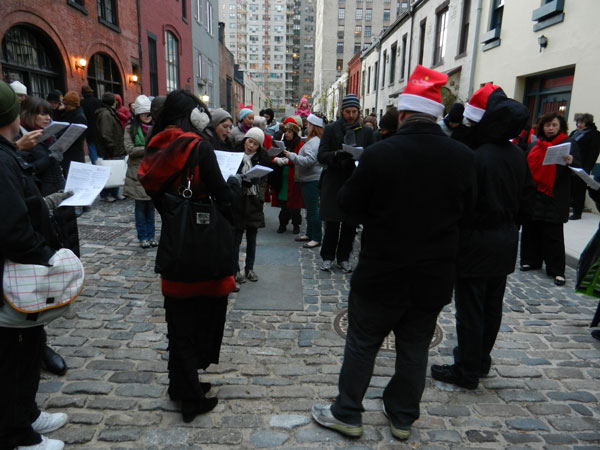 Just Do Art 1 Have songbook, will travel: Carolers make a stop at Washington Mews, during 2012’s Greenwich Village Caroling Walk. PHOTO BY DAVIS FOULGER